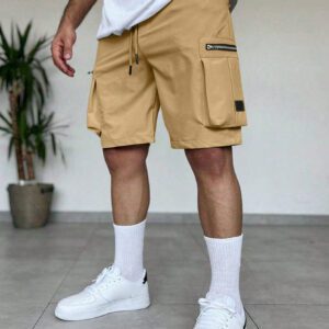 Manfinity EMRG Shorts d'été pour homme à taille élastique à cordon avec conception zippée, couleur unie crème avec style street wear