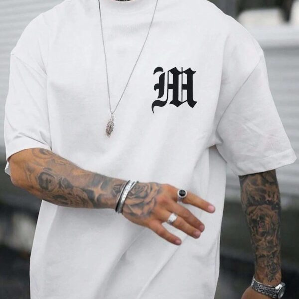 Manfinity Homme T-shirts pour hommes en coupe ajustée Col ras du cou Épaules tombantes T-shirt graphique à manches courtes Mode décontractée Vêtements pour hommes Haut tricoté