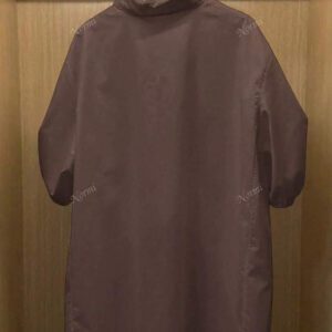 Chemise casual d'été en polyester pour femmes, de couleur unie, à manches courtes et coupe asymétrique
