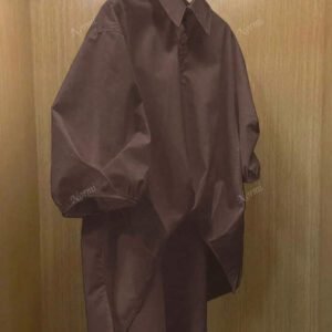 Chemise casual d'été en polyester pour femmes, de couleur unie, à manches courtes et coupe asymétrique