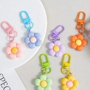 Porte-clés fleur de marguerite colorée et transparente, accessoires pour femmes et étudiantes, étui pour écouteurs, décoration de voiture, porte-clés fleur transparente d'Halloween, charms de porte-clés mignons, pendentifs de sac, cadeaux pour demoiselles d'honneur