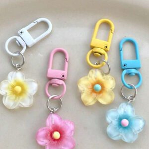 Porte-clés fleur de marguerite colorée et transparente, accessoires pour femmes et étudiantes, étui pour écouteurs, décoration de voiture, porte-clés fleur transparente d'Halloween, charms de porte-clés mignons, pendentifs de sac, cadeaux pour demoiselles d'honneur
