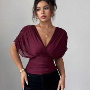 Elenzga T-shirt femme avec manches à volants, col croisé, taille froncée et ourlet à volants. Fabriqué en tissu élastique à doublure en maille, convenant pour les vacances, la plage et les tenues décontractées. Idéal pour les sorties et les déplacements printaniers et estivaux.