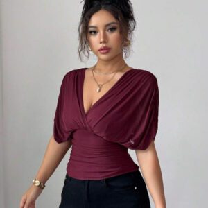 Elenzga T-shirt femme avec manches à volants, col croisé, taille froncée et ourlet à volants. Fabriqué en tissu élastique à doublure en maille, convenant pour les vacances, la plage et les tenues décontractées. Idéal pour les sorties et les déplacements printaniers et estivaux.