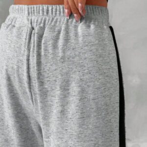 SHEIN Pantalon de survêtement à taille élastique, coupe droite, avec rayures sur les côtés
