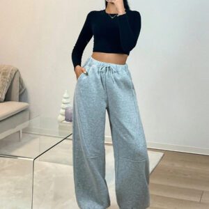 Pantalon de survêtement tricoté à taille basse avec motif patchwork et design unique d'ourlet