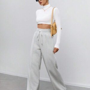 SHEIN Tall Pantalon de survêtement thermique à taille élastique et coupe ample en velours de couleur unie, convient pour l'automne et l'hiver