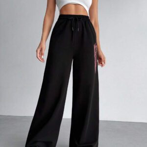 SHEIN Pantalon de survêtement droit à longues jambes effet stretch asymétrique à la taille imprimé Brooklyn