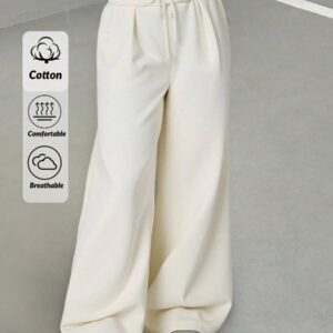 Pantalon de survêtement décontracté premium, design confortable à taille élastique contemporaine, élément urbain essentiel aux tons neutres sophistiqués, pantalon chic décontracté professionnel, innovation minimaliste de luxe avec cordon de serrage et accent de denim moderne