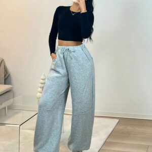 Pantalon de survêtement tricoté à taille basse avec motif patchwork et design unique d'ourlet