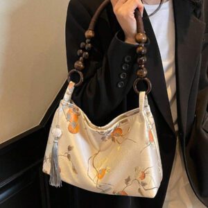 Sac à épaule en suédine en forme de nuage, sac en forme de dumpling à la mode avec un design unique, sac à main en daim, s'assortissant parfaitement aux tenues d'automne pour femmes